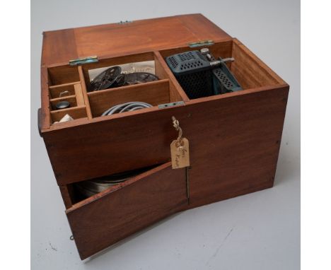A vintage cine film projector 'the Kodascope' model c for 16mm film housed within a mahogany fitted case with accessories spo
