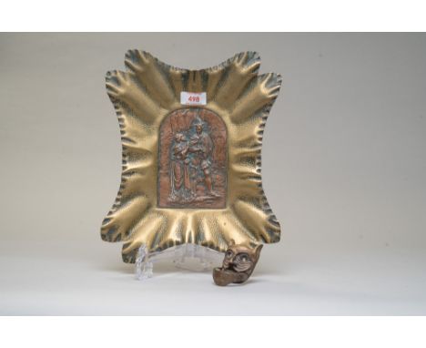 A Victorian brass and copper relief plaque depicting an occult style image of the Devil enticing a lady, and a similar brass 