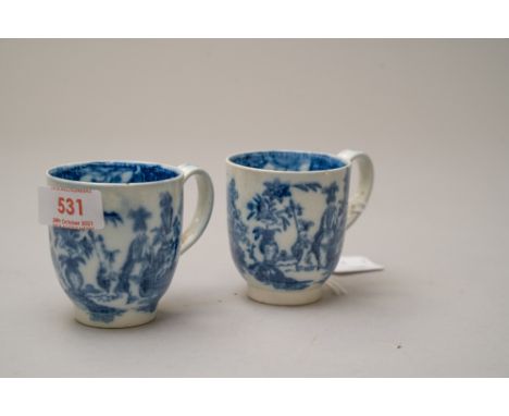 A pair of late Georgian tea cups in a Worcester style design depicting lady sat with a tin glaze