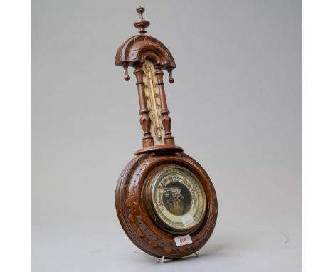 A traditional Victorian small banjo form barometer having mercury thermometer with visible mechanism behind enamel face dial