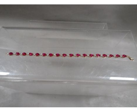 A 9ct gold gemset tennis bracelet stamped 375, approx L 18.5 cm, overall weight approx. 7.39 g
