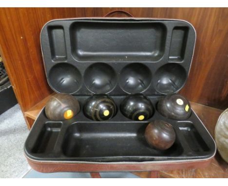 A selection of cased lawn bowls