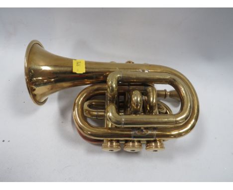 A brass pocket cornet