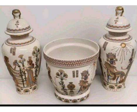 A Pair of Egyptian panda ware porcelain temple jars along with a jardinière planter and a brass eagle plaque 