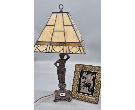 Cast metal figural table lamp fitted with a Tiffany style shade together with an Indian inspired white metal bird picture set