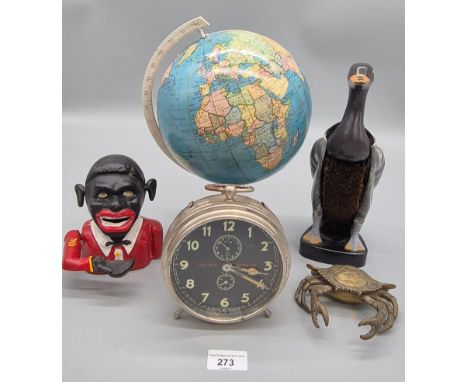 A selection of collectables; Goliath Repeater alarm clock, vintage 1950s desk globe, brass crab inkwell, African Jolly man ba