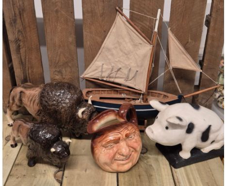 A selection of collectables; Melba ware Bisons, wooden model boat, Royal Doulton Barneycorn old lad Toby jug &amp; wooden pig