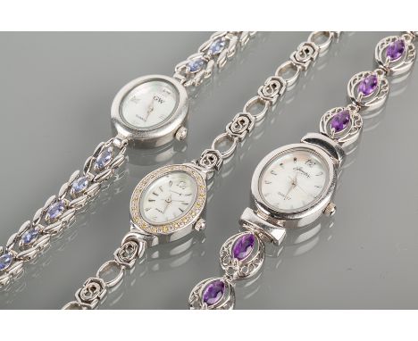 GROUP OF THREE LADY'S SILVER FASHION WATCHES
one with a yellow diamond set bezel, one with an amethyst set bracelet strap, an