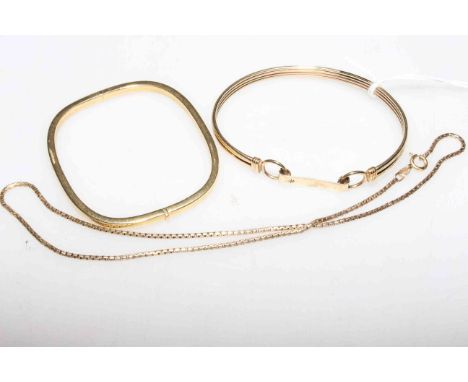 18 carat gold hinged bangle, 10.5 grams; 9 carat gold bangle, 10.2 grams; and a 9 carat gold chain, 6.5 grams