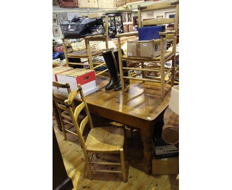 Rectangular pine turned leg kitchen table, 183cm long, together with six rush seated ladder back dining chairs including two 