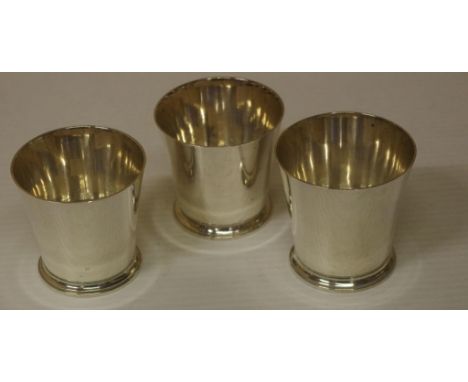 Three Asprey sterling silver whisky tots hallmarked London 1969, 192grams approx