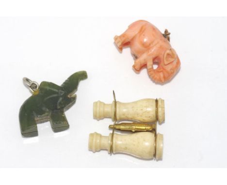 Coral and nephrite jade elephant pendants together with a bone Stanhope set of binoculars (one image missing)
