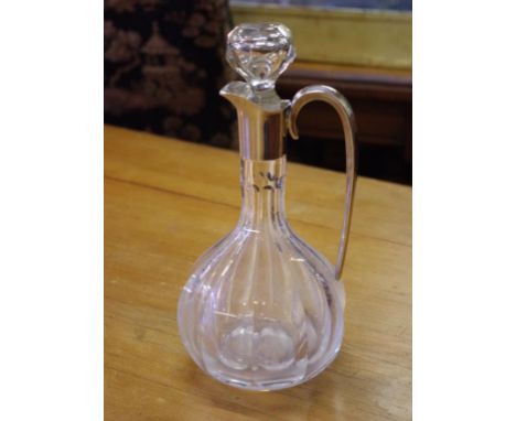 Sterling silver and glass claret jug marked STERLING, 27cm high approx
