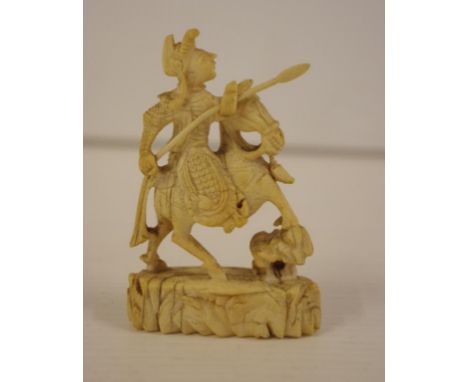 Chinese carved ivory figure group circa 1930 depicting a warrior on horseback, 7.5cm high. NB. This item cannot be exported.