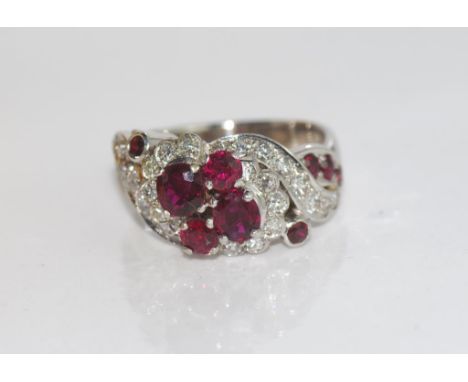 18ct white gold ruby and diamond ring in original Bruce and Walsh box, weight: approx 8.8 grams, size: O/7