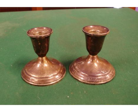 Pair of sterling silver candle holders 8cm high approx.