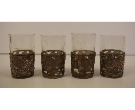 Four Chinese Ye Ching silver shot cups with pierced dragon sides, impressed YE CHING STERLING marks to bases, 6.5cm high appr
