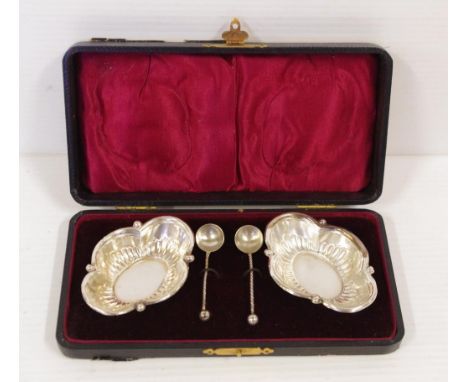 Boxed pair sterling silver salts and spoons hallmarked Birmingham 1909, 19 grams approx.