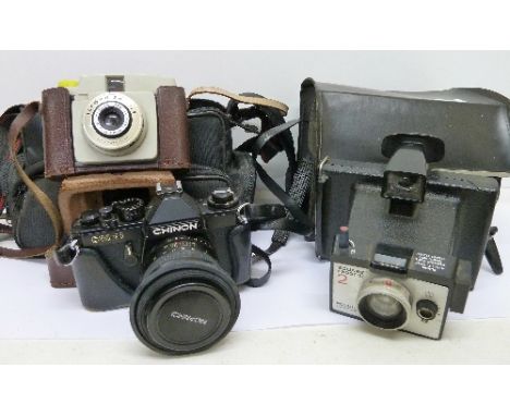 A Chinon CM-3 camera with lens, an Ilford Sporti 4 camera, a Polaroid camera and a Vivitar camera