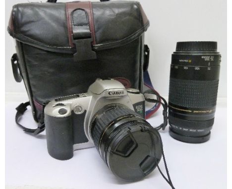 A Canon EOS 500 camera with two lenses and case