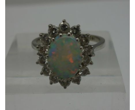 An 18ct white gold, opal and diamond ring, weight 2.5g, size M