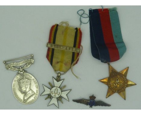 An enamel cross medal with 1914-1918 bar, a George VI Territorial Medal, a 1939-1945 Star and a R.A.F. badge