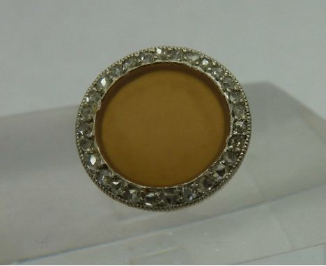 A single Cartier gold and diamond button, weight 2.2g