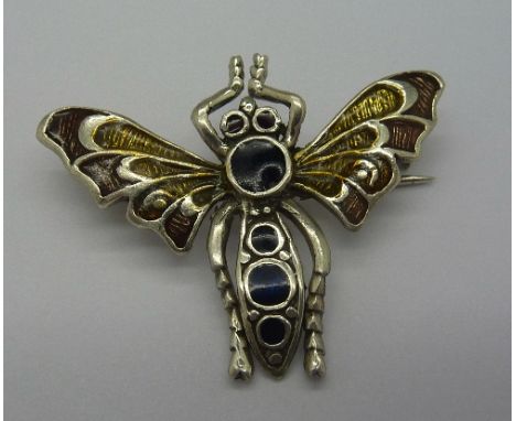 A modern silver and enamel bee brooch