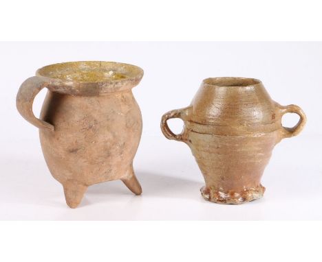 A 16th century German stoneware jugThe ovoid body with ring decoration and loop handles, 15cm high, together with a 17th cent