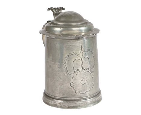 A William & Mary pewter domed-lidded wrigglework tankard, circa 1690OEAS quart, the drum decorated to the front with a large 