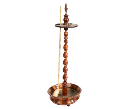 A 19th century treen Church Warden pipe standWith finial top, above a disc of three circular holes, on a spiral-twist stem an