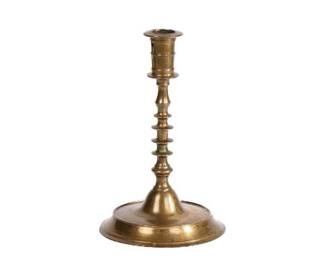 A rare early -to mid 16th century brass candlestick, Nuremberg, circa 1500-1550Having a gently tapering candle socket, with f