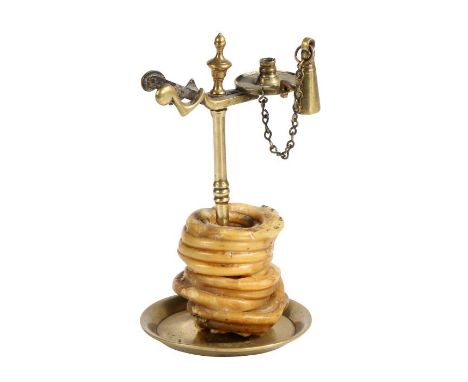 A brass wax-jack, probably early -mid 19th century, EnglishDesigned for a pre-coiled taper, dropped over the slender stem by 