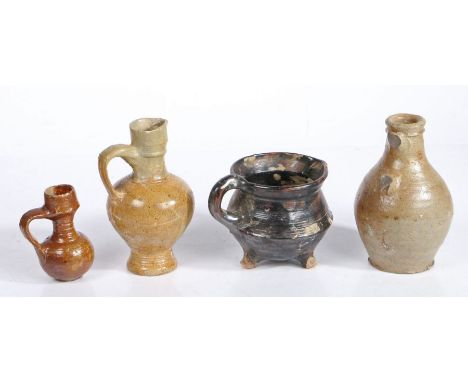 A 17th century stoneware jugWith restored collar above the bulbous body;, together with a bottle with missing handle; a resto