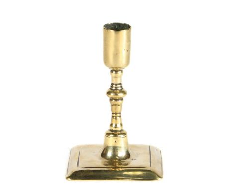                         A good small brass candlestick, circa 1700                         In the Huguenot manner, having a p