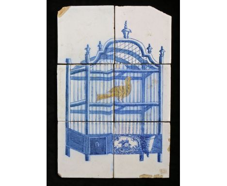 An 18th Century Dutch Delft tile panelPainted mainly in blue, with a caged yellow bird, 26cm x 40cm