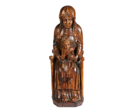 An 18th century carved walnut Sedes SapientiaeThe Madonna and Child seated on the Seat of Wisdom, 48cm high