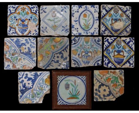 A collection of 18th century polychrome tilesTo include foliate examples corner sections, and a framed tile depicting a friti