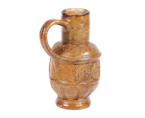 A Raeren late 16th/early 17th century stoneware jugWith a ribbed neck above portrait medallions of figures above heraldic cre