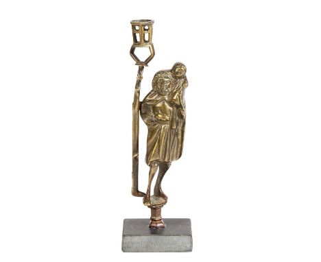An early 16th century style brass figural candlestick, in the circa 1500 mannerThe figure dressed in robes holding a lantern 