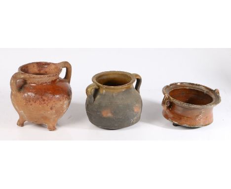 17th Century Dutch potteryTo include a cauldron with loop handles, 10cm high; a twin-handled pot, 14.5cm high; and another wi