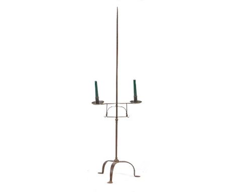 A floor-standing iron adjustable candle standThe end-pointed stem with a dual adjustable candlesticks, on tripod support, 132