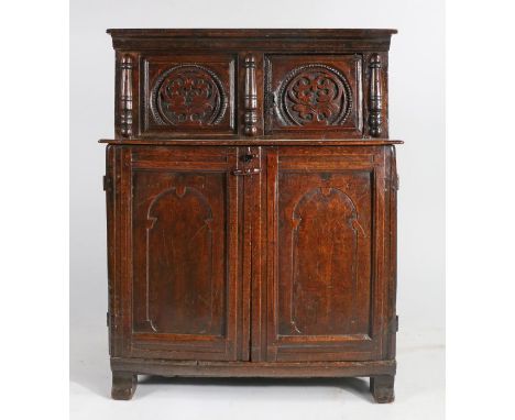An unusual and small Charles II oak cupboard, North Wales, circa 1670Having a recessed cupboard, with boarded top, and access