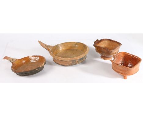 17th century Dutch pottery cooking waresTo include two skillets, a tripod pot and a loop handled pot, (4)