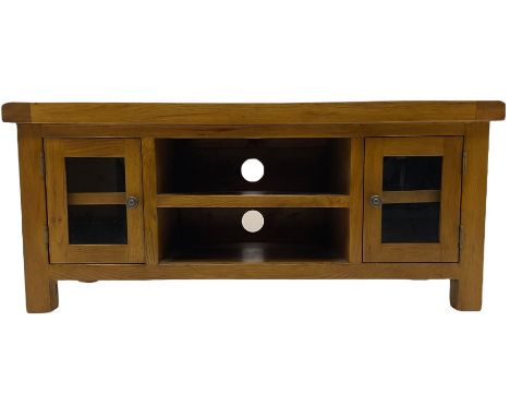 Medium oak entertainment unit, fitted with two glazed cupboards and open console shelvesDimensions: Height:&nbsp;50cm&nbsp; L