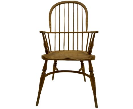 Georgian style light elm Windsor armchair, high comb back, saddle seat, crinoline stretcher baseDimensions: Height:&nbsp;108c