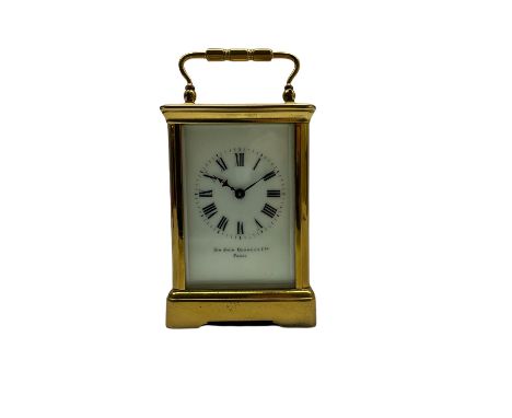 A mid-19th century French timepiece carriage clock in a corniche case with a white enamel dial and Roman numerals, minute mar