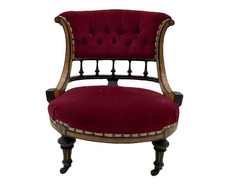 Victorian ebonised and amboyna nursing chair, the curved serpentine upright supports joined by balustrade, upholstered seat a