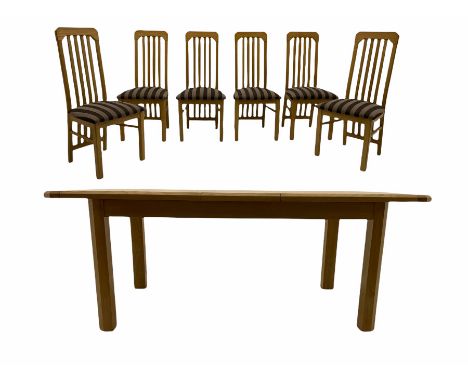 Light oak extending dining table, with six matching chairs, the seat pads upholstered in striped grey and black fabricDimensi