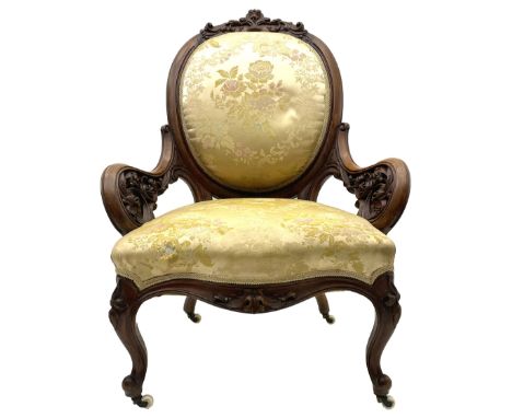 Victorian walnut lady's drawing room chair, the cameo back cresting rail carved with scrolled foliate and central cartouche, 